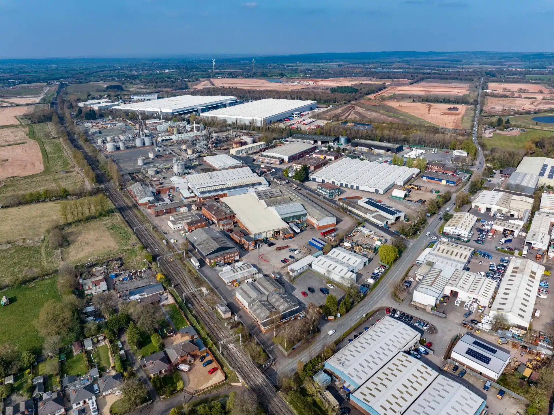 Aerial view of large industrial estate in countryside.