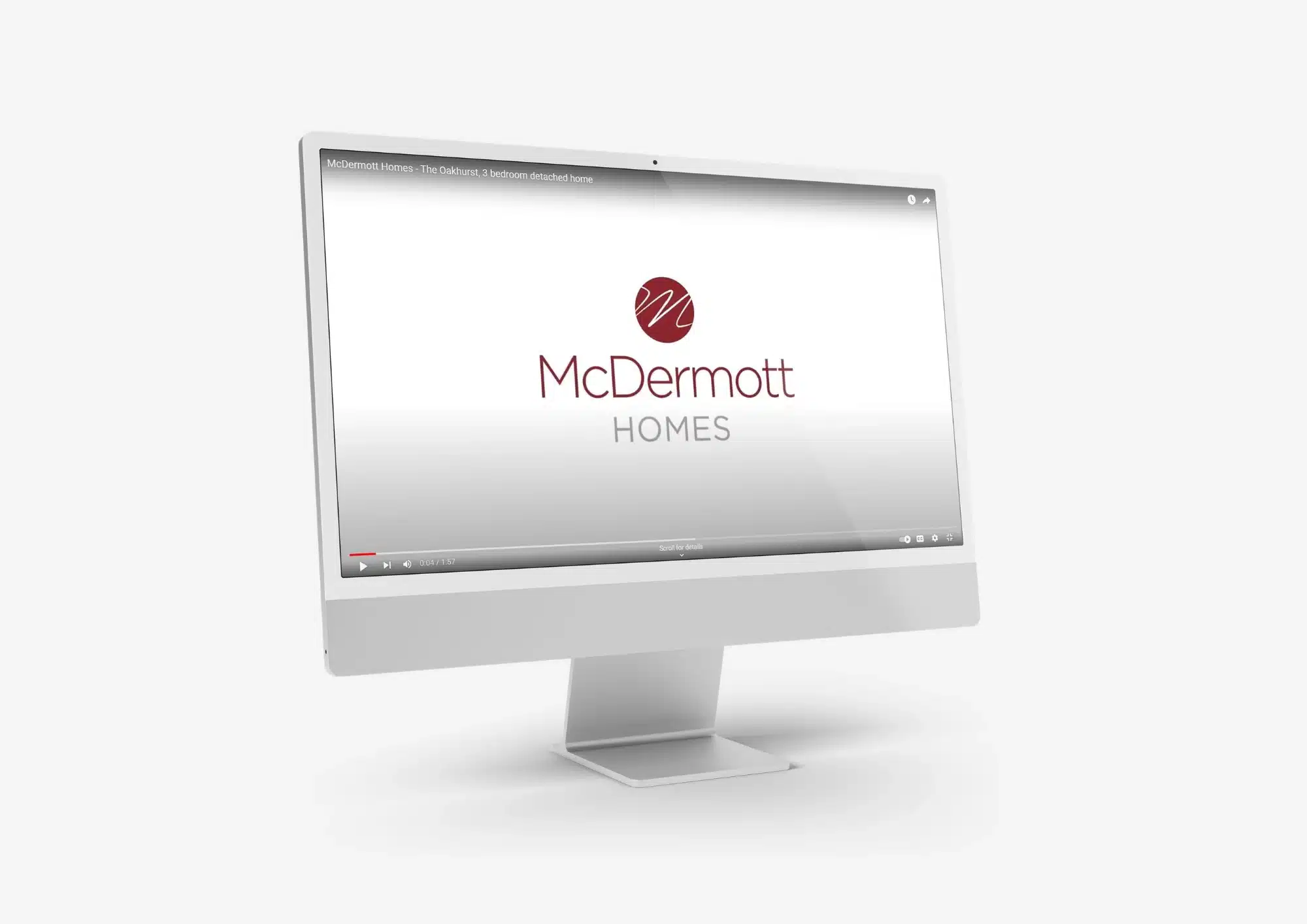 Computer monitor displaying McDermott Homes promotional video