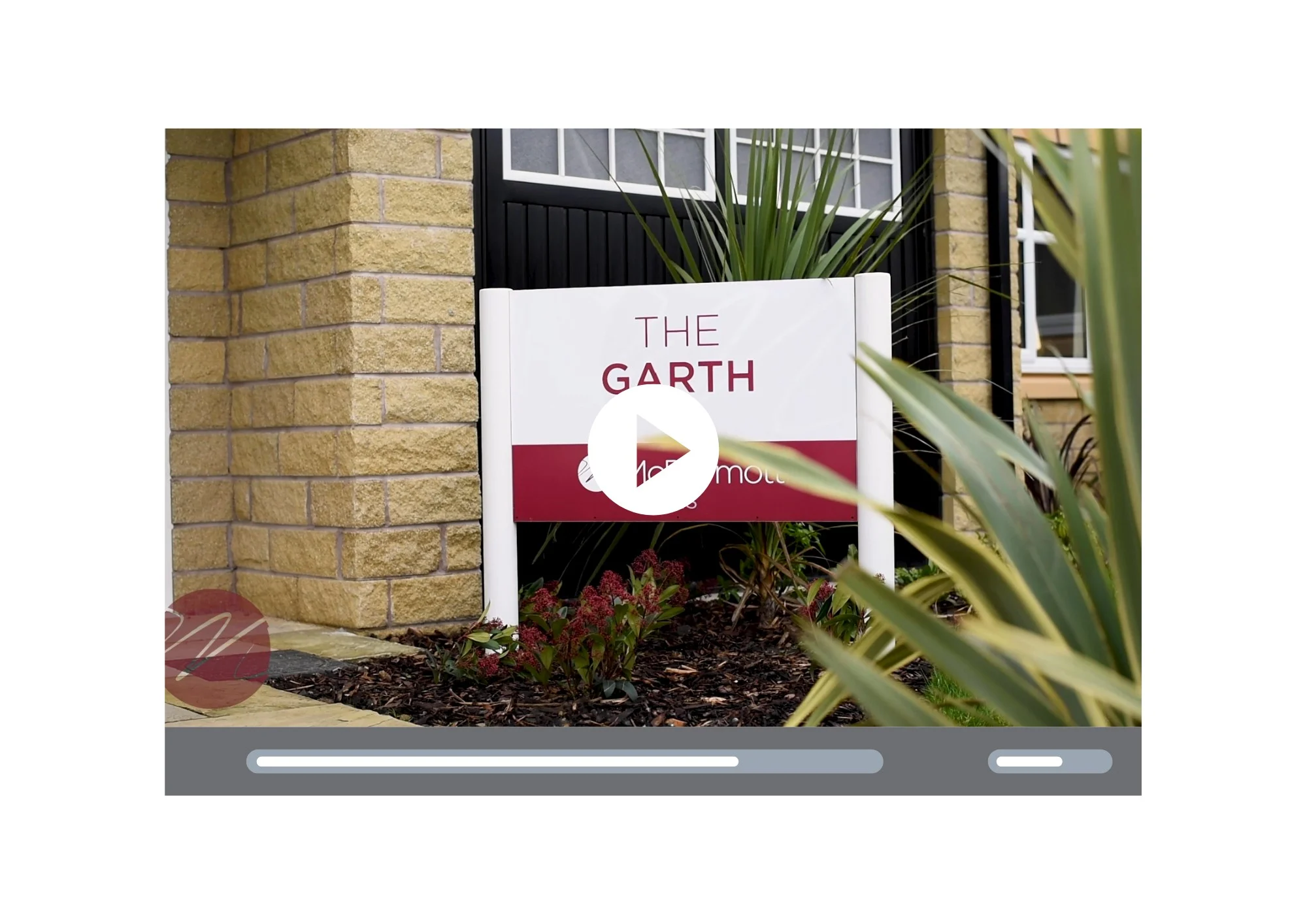 The Garth care home entrance sign beside landscaped plants