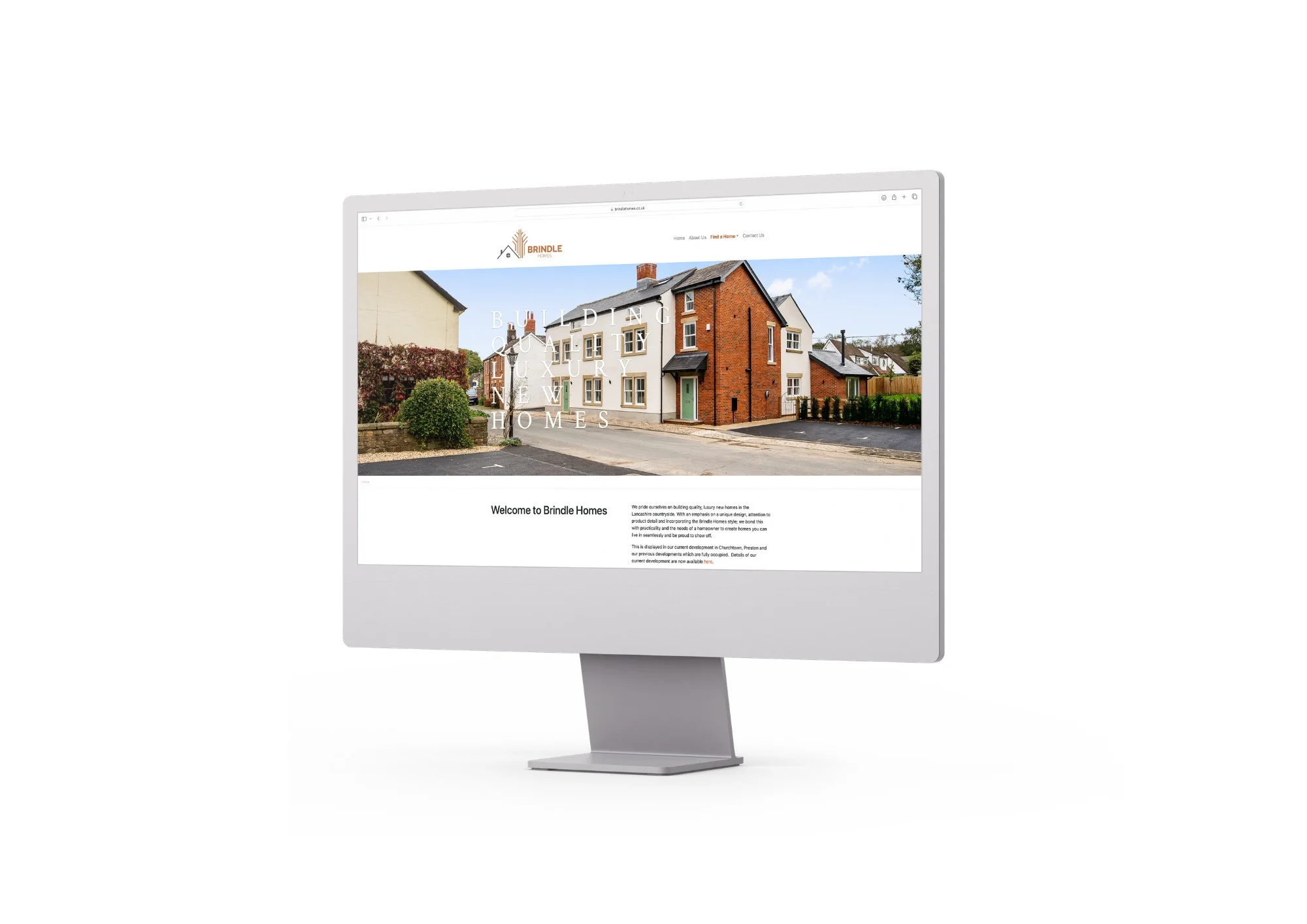 Desktop monitor displaying Brindle Homes property website